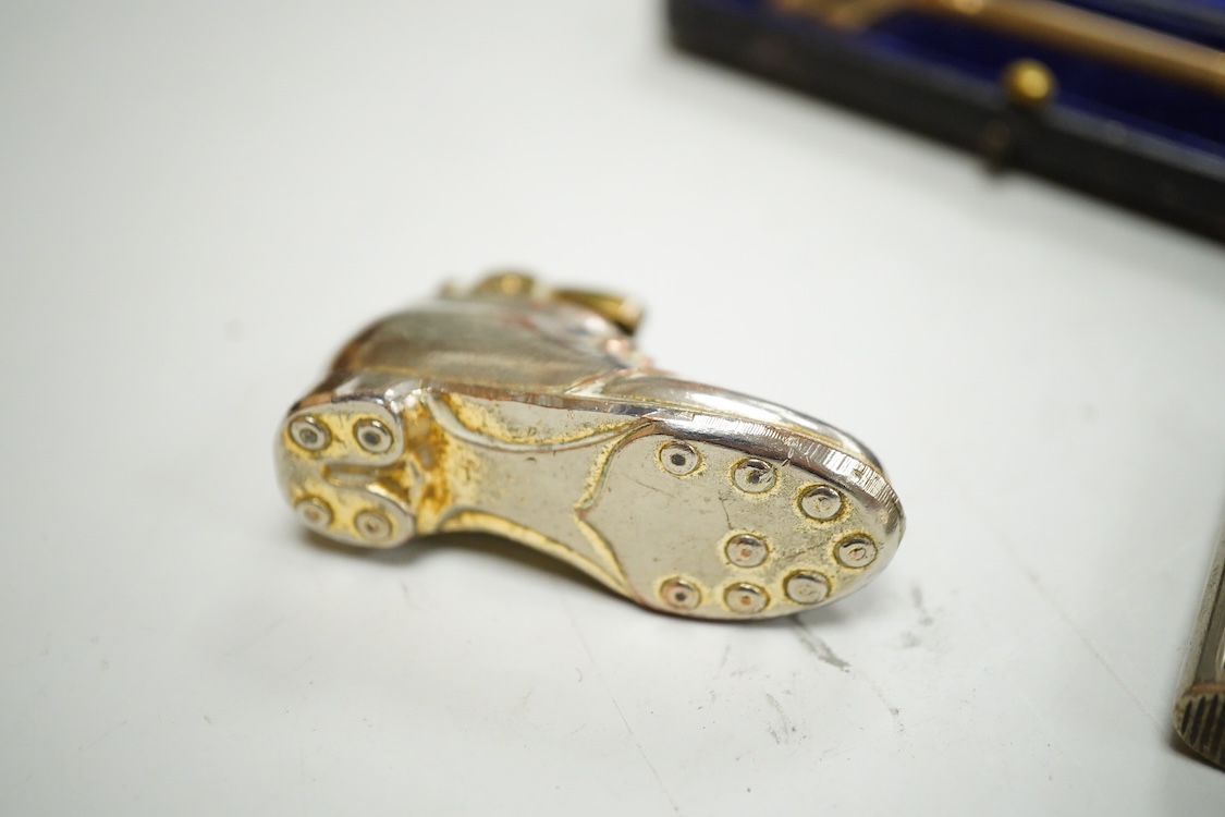 A collection of sundry items to include a large cased key, novelty lighter in the form of a shoe and a citrine set propelling pencil